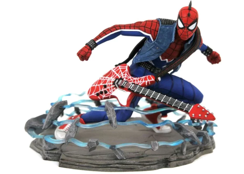 Estatua de Spider-Punk agachándose mientras en el suelo se forma algo así como energía azul, Spidey lleva la chupa y la guitarra -distinta esta vez-, claro.